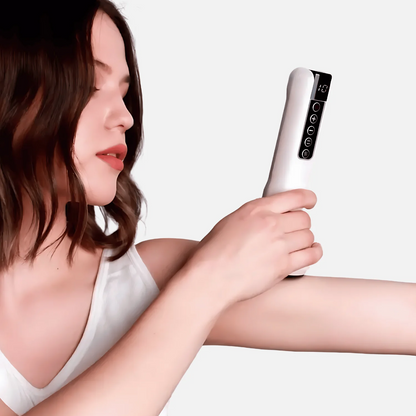 User using white anti-cellulite massager on arm